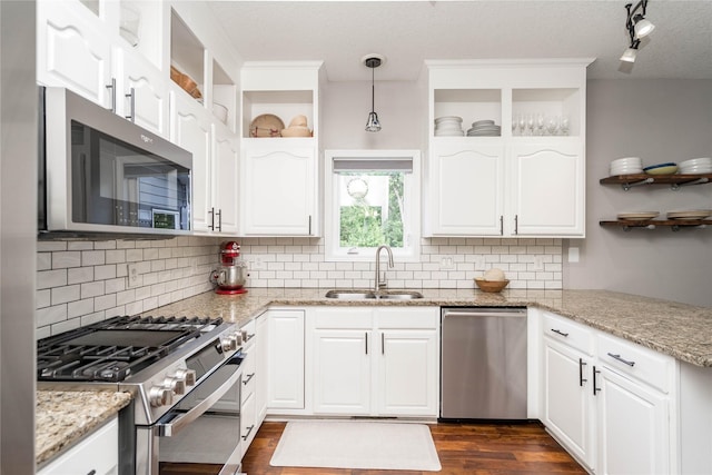 3605 80th St, Urbandale, IA 50322 - kitchen featuring appliances with stainless steel finishes, open shelves, tasteful backsplash, white cabinets, and a textured ceiling