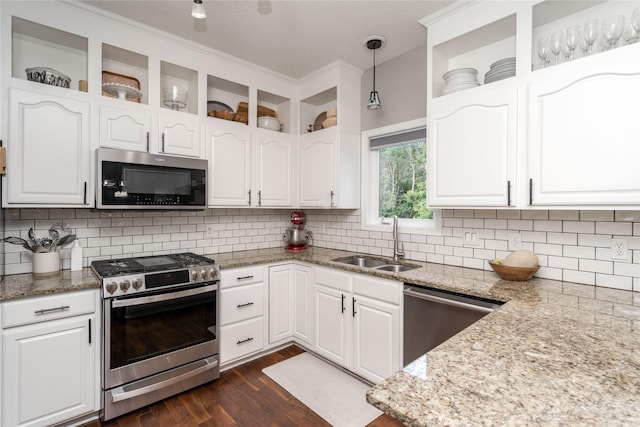 3605 80th St, Urbandale, IA 50322 - kitchen with stainless steel appliances, white cabinetry, dark wood finished floors, backsplash, and a textured ceiling