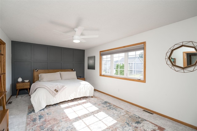 3605 80th St, Urbandale, IA 50322 - bedroom with carpet, ceiling fan, and a decorative wall