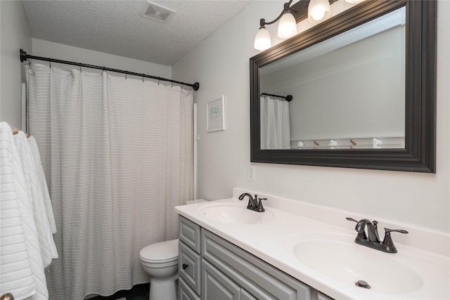 3605 80th St, Urbandale, IA 50322 - full bathroom featuring double vanity, a textured ceiling, and curtained shower