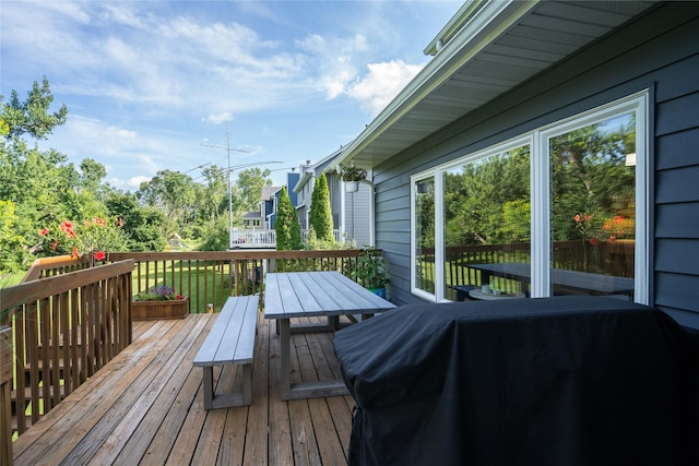 3605 80th St, Urbandale, IA 50322 - wooden deck featuring grilling area and outdoor dining space