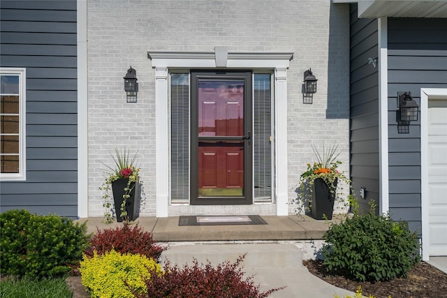 3605 80th St, Urbandale, IA 50322 - view of exterior entry featuring brick siding