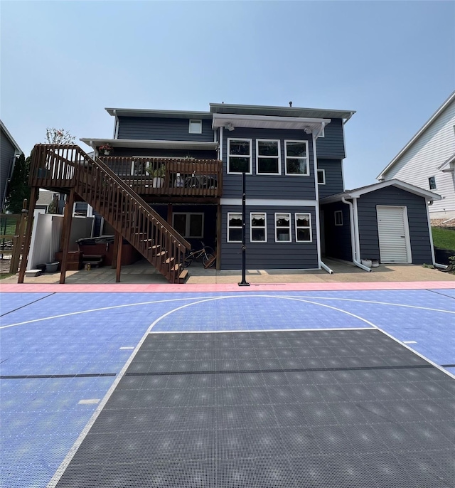 3605 80th St, Urbandale, IA 50322 - view of basketball court featuring basketball court, stairs, and a storage unit