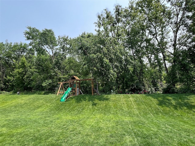 3605 80th St, Urbandale, IA 50322 - view of green lawn featuring a playground