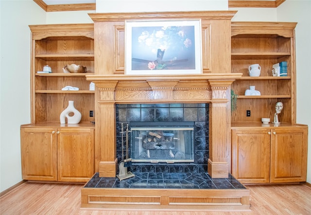 5925 Ep True Pkwy Unit 36, West Des Moines, IA 50266 - detailed view of wood finished floors, a fireplace, and ornamental molding
