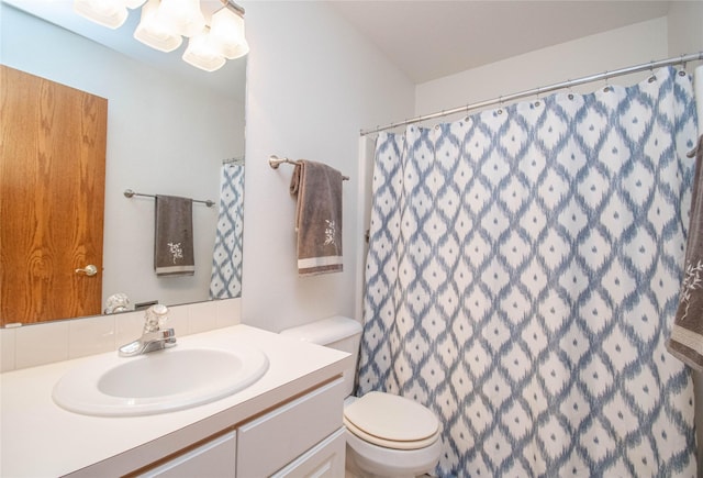 5925 Ep True Pkwy Unit 36, West Des Moines, IA 50266 - full bathroom featuring vanity, decorative backsplash, and curtained shower