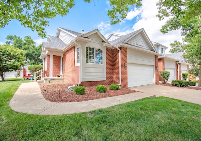 5925 Ep True Pkwy Unit 36, West Des Moines, IA 50266 - view of front of house featuring a garage, brick siding, a front lawn, and driveway