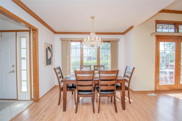 5925 Ep True Pkwy Unit 36, West Des Moines, IA 50266 - dining room with a chandelier, ornamental molding, light wood-style flooring, and french doors