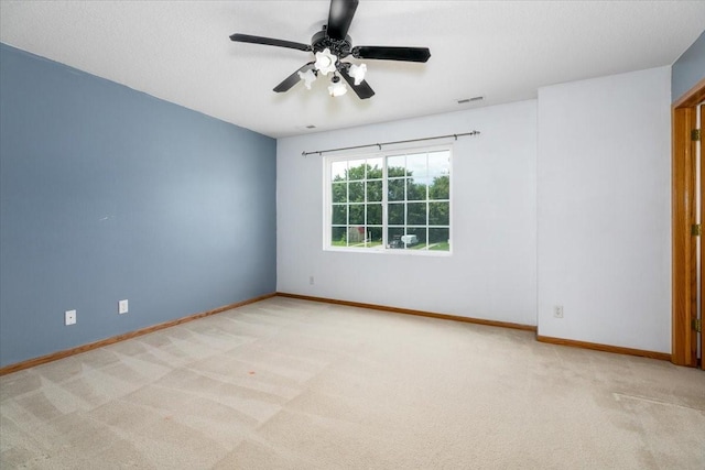 6825 Star View St, Des Moines, IA 50320 - unfurnished room featuring light colored carpet and a ceiling fan
