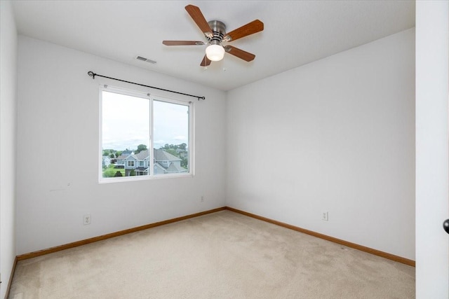 6825 Star View St, Des Moines, IA 50320 - unfurnished room featuring light carpet and ceiling fan