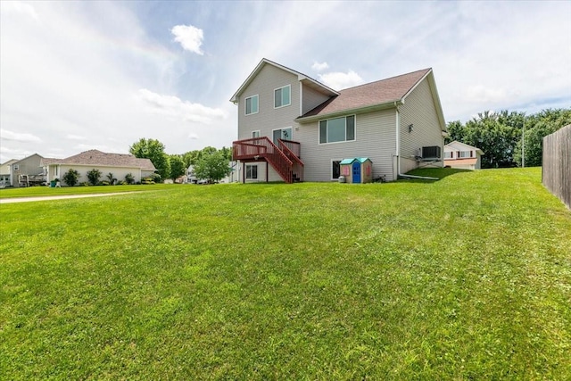 6825 Star View St, Des Moines, IA 50320 - back of house with stairway, a yard, and a wooden deck