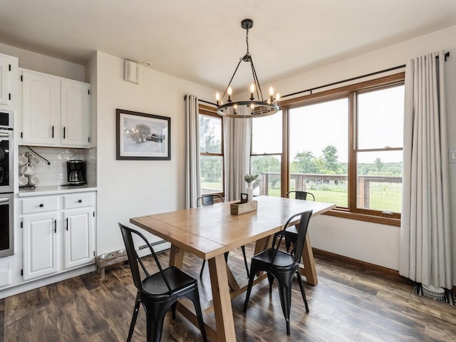 4791 Erbe St, Norwalk, IA 50211 - dining area with a chandelier and dark wood finished floors