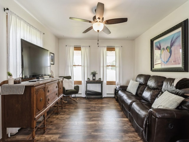 4791 Erbe St, Norwalk, IA 50211 - living area with a ceiling fan, dark wood-style flooring, and baseboard heating