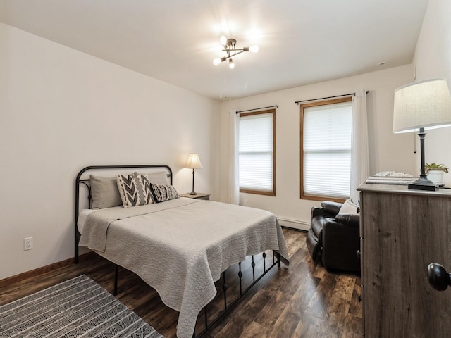 4791 Erbe St, Norwalk, IA 50211 - bedroom with dark wood-style floors and a baseboard radiator