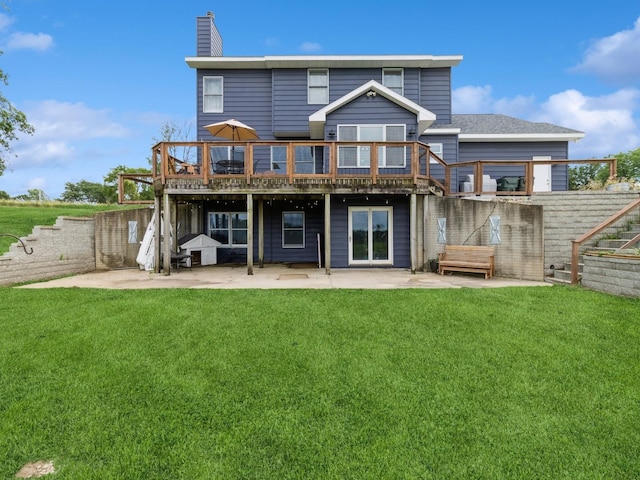 4791 Erbe St, Norwalk, IA 50211 - rear view of house featuring a patio area, a deck, and a lawn