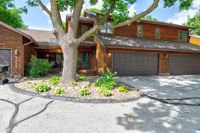 1116 42nd St, West Des Moines, IA 50266 - view of front of property featuring driveway and an attached garage