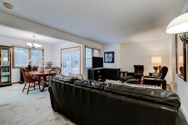 1116 42nd St, West Des Moines, IA 50266 - living area featuring a chandelier and light marble finish floors