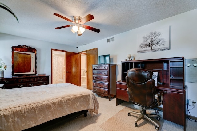 1116 42nd St, West Des Moines, IA 50266 - carpeted bedroom with an office area, ensuite bathroom, ceiling fan, and a textured ceiling