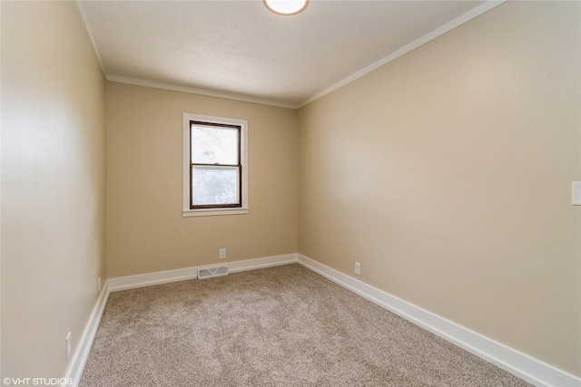 1212 Burnham Ave, Des Moines, IA 50315 - carpeted spare room featuring crown molding and baseboards