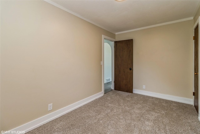 1212 Burnham Ave, Des Moines, IA 50315 - carpeted empty room featuring crown molding and baseboards
