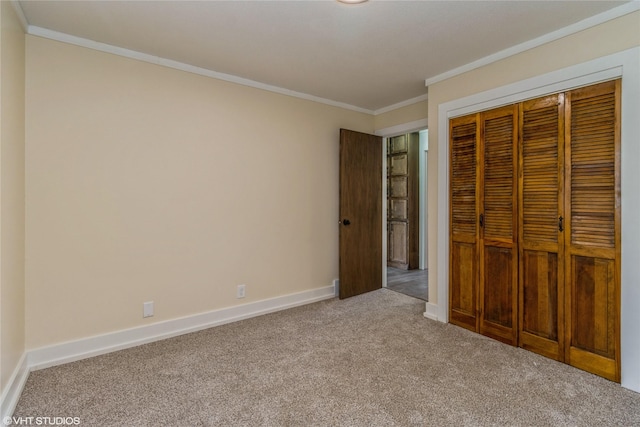 1212 Burnham Ave, Des Moines, IA 50315 - unfurnished bedroom featuring carpet flooring, crown molding, and a closet