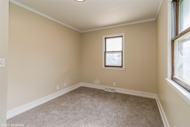 1212 Burnham Ave, Des Moines, IA 50315 - unfurnished room featuring carpet, healthy amount of natural light, and crown molding