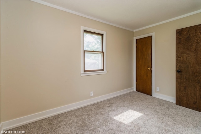 1212 Burnham Ave, Des Moines, IA 50315 - carpeted empty room with crown molding and baseboards