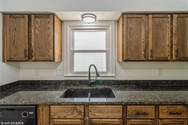 1212 Burnham Ave, Des Moines, IA 50315 - kitchen with dishwasher and dark stone countertops