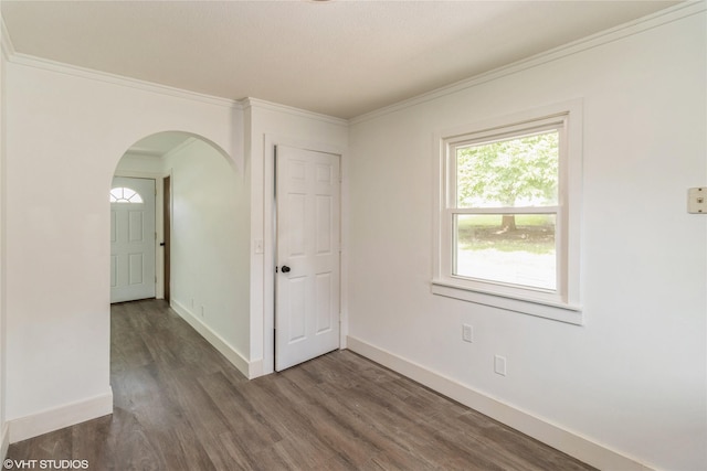 1212 Burnham Ave, Des Moines, IA 50315 - spare room with arched walkways, wood finished floors, and crown molding