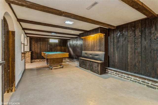 1212 Burnham Ave, Des Moines, IA 50315 - playroom featuring wood walls, finished concrete flooring, beamed ceiling, billiards, and arched walkways