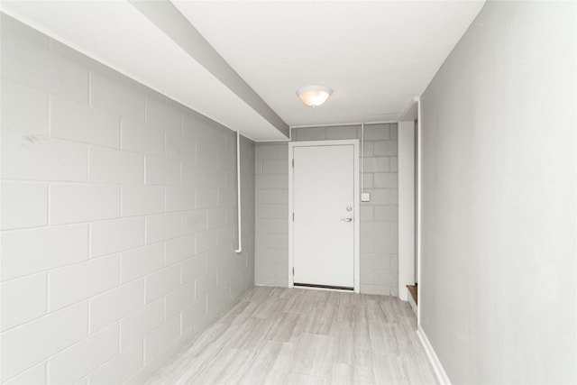 2512 Boston Ave, Des Moines, IA 50310 - hall with concrete block wall and light wood finished floors