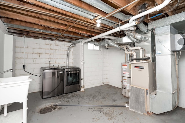 2512 Boston Ave, Des Moines, IA 50310 - unfinished basement featuring washer and clothes dryer, water heater, concrete block wall, and a water softener system