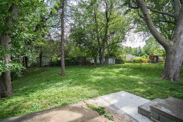 2512 Boston Ave, Des Moines, IA 50310 - fenced backyard with a patio and a storage shed
