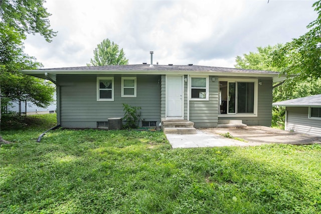 2512 Boston Ave, Des Moines, IA 50310 - rear view of house with a yard and a patio area