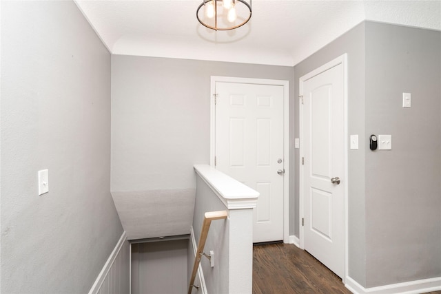 2512 Boston Ave, Des Moines, IA 50310 - corridor with dark wood-type flooring and an upstairs landing
