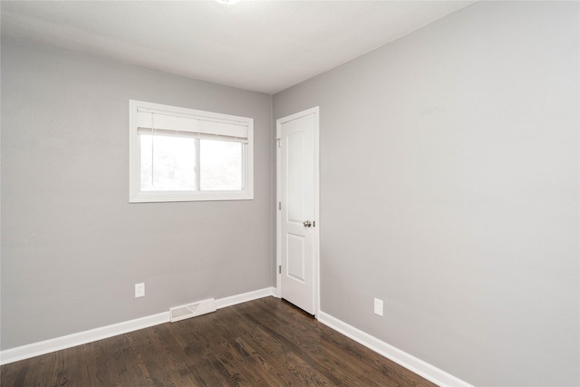 2512 Boston Ave, Des Moines, IA 50310 - spare room with baseboards and dark wood-style floors