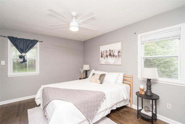 2512 Boston Ave, Des Moines, IA 50310 - bedroom featuring dark wood-style flooring, multiple windows, and ceiling fan
