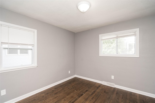 2512 Boston Ave, Des Moines, IA 50310 - empty room with baseboards and dark wood-type flooring