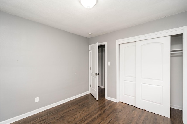 2512 Boston Ave, Des Moines, IA 50310 - unfurnished bedroom with dark wood finished floors and a closet