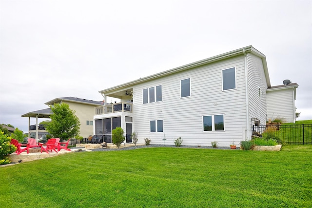 685 Indian Ridge Dr, Waukee, IA 50263 - rear view of house featuring a fire pit, a balcony, a sunroom, a ceiling fan, and a patio