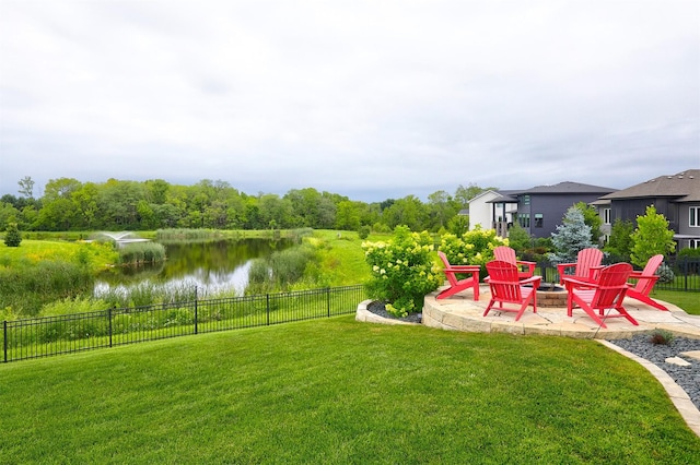685 Indian Ridge Dr, Waukee, IA 50263 - view of yard with an outdoor fire pit, a water view, and a patio