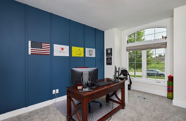 685 Indian Ridge Dr, Waukee, IA 50263 - carpeted home office featuring a textured ceiling and baseboards