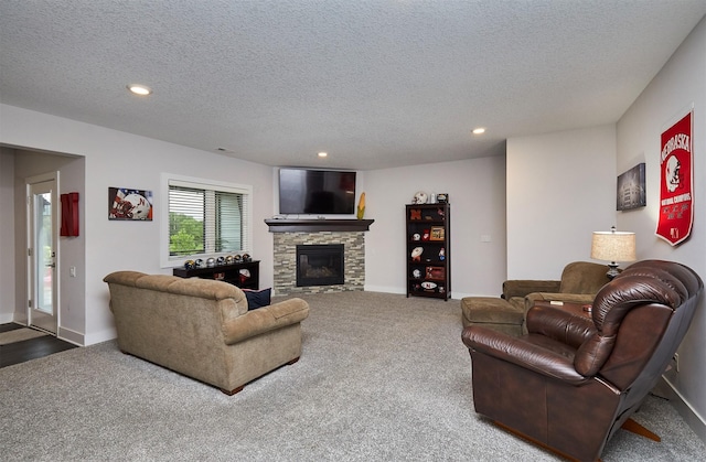 685 Indian Ridge Dr, Waukee, IA 50263 - carpeted living area with a textured ceiling, recessed lighting, and a fireplace