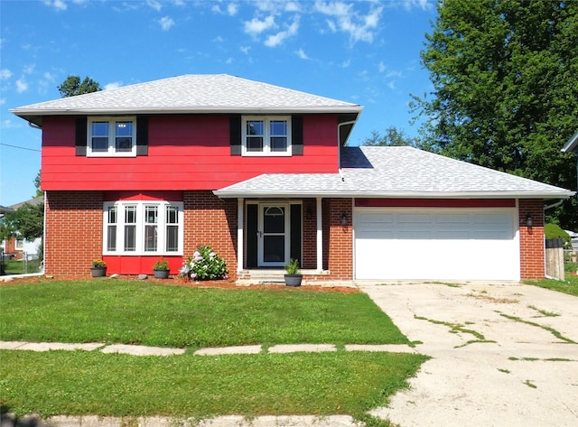 623 E 18th St N, Newton, IA 50208 - view of front of property with concrete driveway, a front lawn, an attached garage, roof with shingles, and brick siding