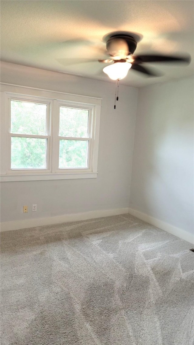 623 E 18th St N, Newton, IA 50208 - unfurnished room featuring a ceiling fan and carpet