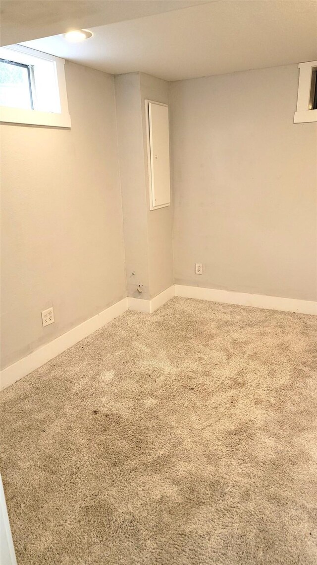 623 E 18th St N, Newton, IA 50208 - basement featuring carpet flooring and baseboards