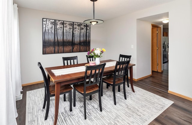 14449 Briarwood Ln, Urbandale, IA 50323 - dining space featuring wood finished floors and baseboards