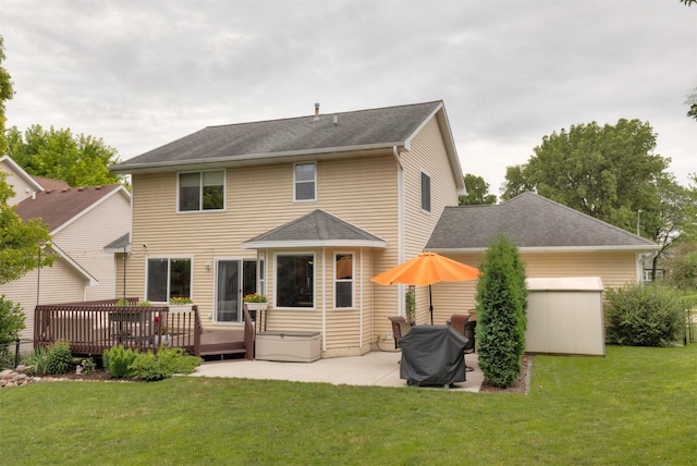 14449 Briarwood Ln, Urbandale, IA 50323 - rear view of house with a lawn, a patio, a deck, and a shingled roof