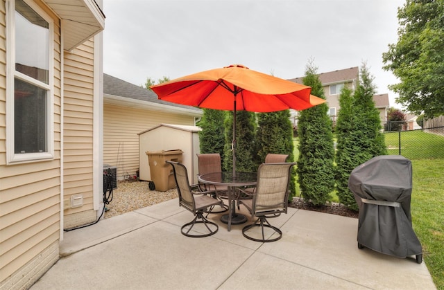 14449 Briarwood Ln, Urbandale, IA 50323 - view of patio featuring outdoor dining space and a grill