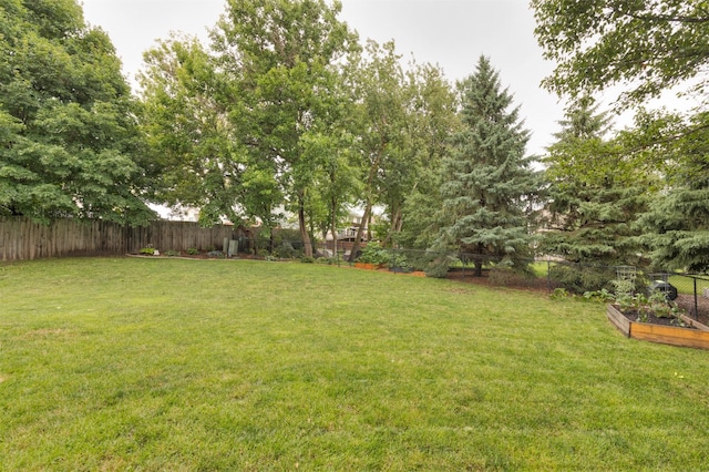 14449 Briarwood Ln, Urbandale, IA 50323 - fenced backyard featuring a garden